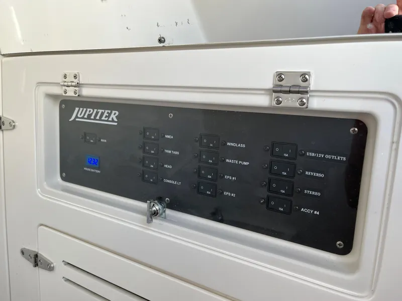 Slide: The Image of Control panel of 2020 Jupiter 34 Center Console boat with labeled switches. - 39