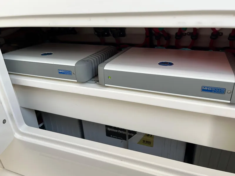 Slide: The Image of 2020 Jupiter 34 Center Console electronics compartment with modern equipment. - 40