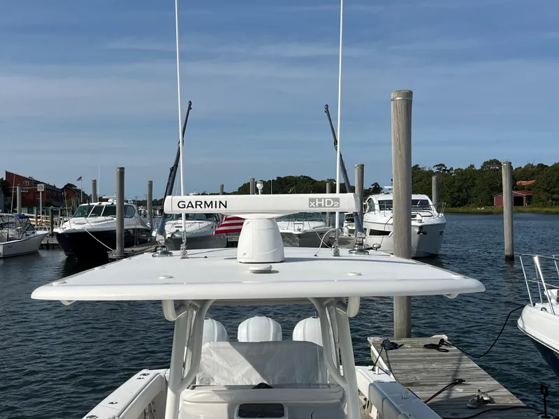 Slide: The Image of 2020 Jupiter 34 Center Console boat docked with Garmin radar system. - 48