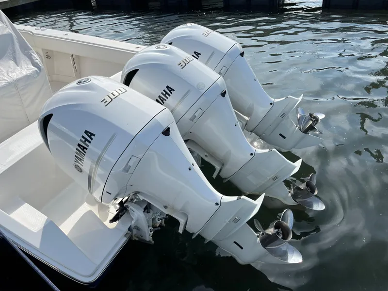 Slide: The Image of Triple Yamaha outboard engines on 2020 Jupiter 34 Center Console boat. - 8