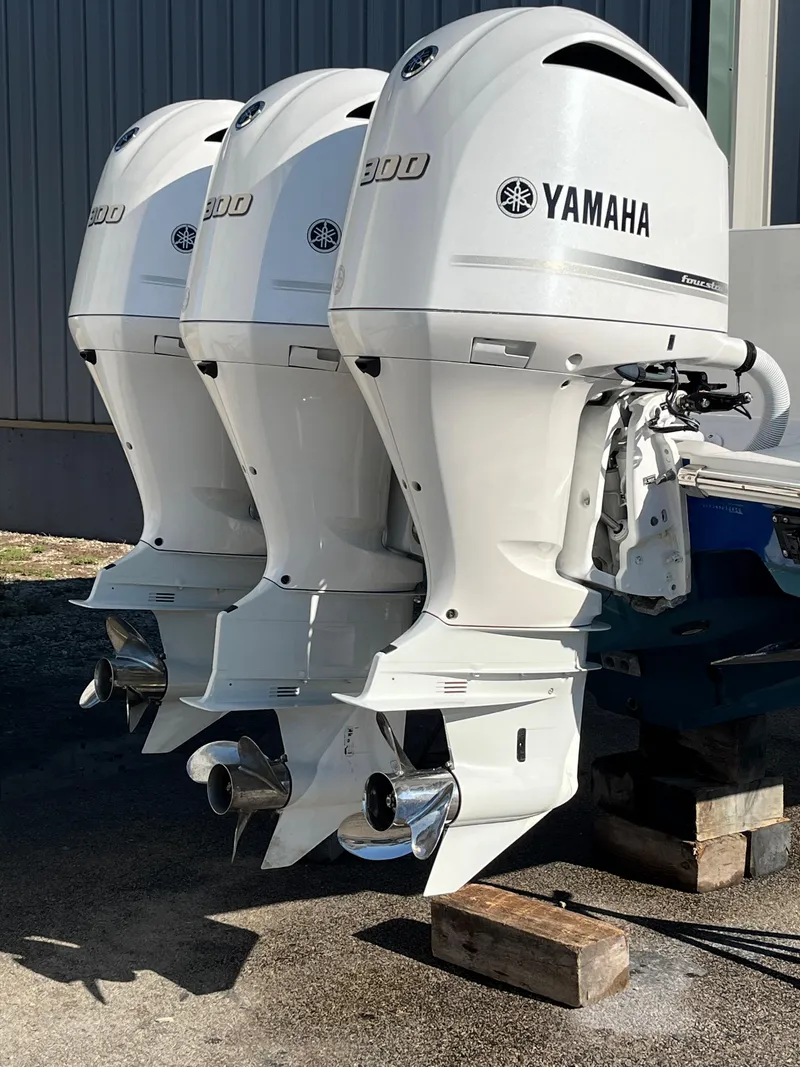 Slide: The Image of Triple Yamaha outboard engines on a 2020 Jupiter 34 Center Console boat. - 9
