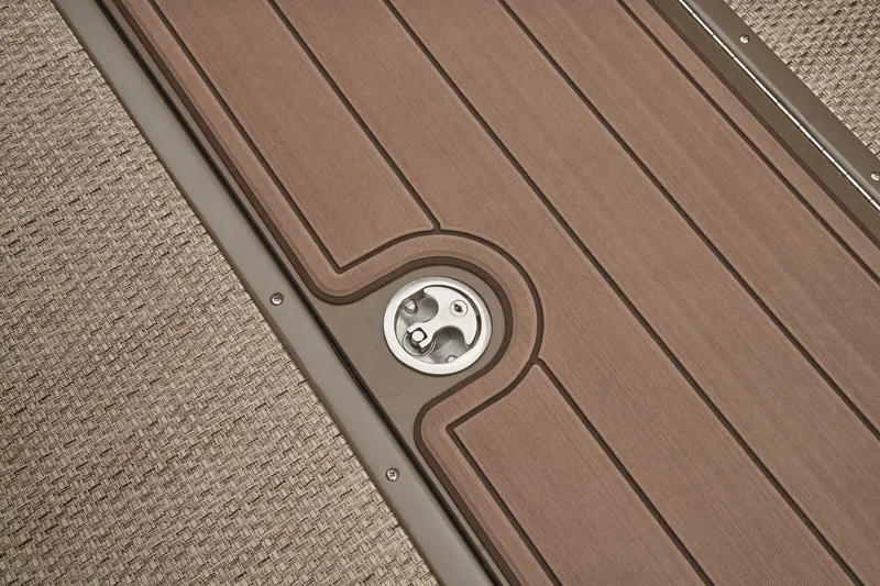 Slide: The Image of 2024 Regency 250 LE3 boat deck with wood finish and metal fixture. - 45