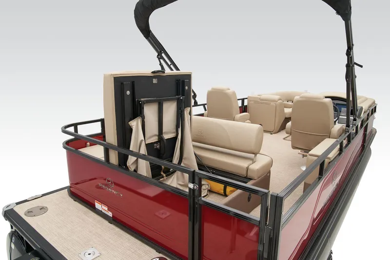 Slide: The Image of 2024 Regency 250 DL3 pontoon boat with beige seating and red exterior. - 38