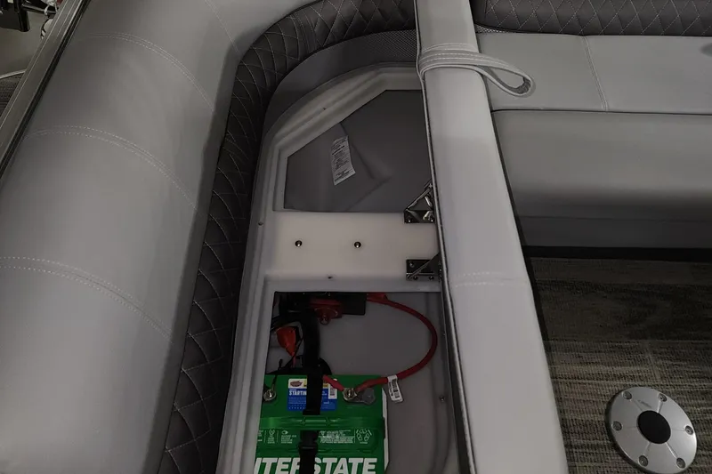 Slide: The Image of 2024 Ranger Reata 220C boat battery compartment with Interstate battery. - 14
