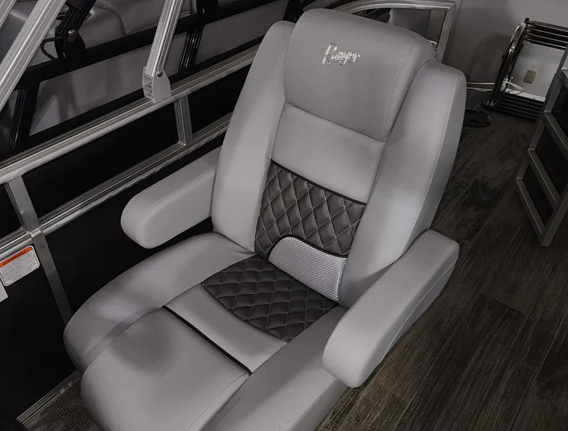 Slide: The Image of 2024 Ranger Reata 220C luxury boat seat with quilted design and armrests. - 15