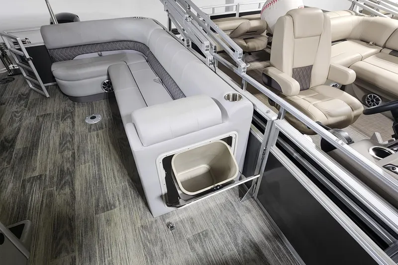 Slide: The Image of 2024 Ranger Reata 220C pontoon boat interior with gray seating and storage compartment. - 5