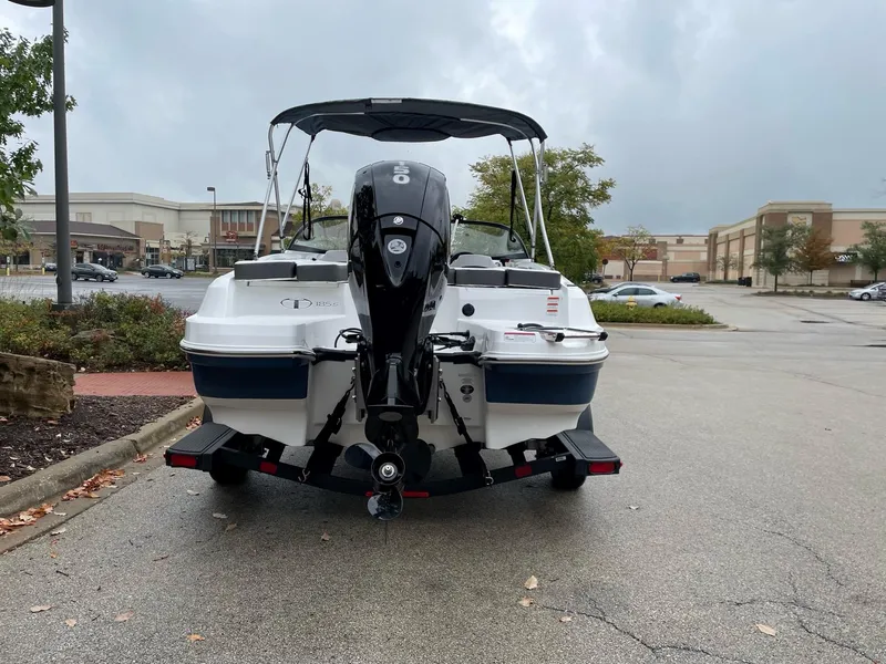 Slide: The Image of 2024 Tahoe 185 S boat with outboard motor in parking lot. - 7
