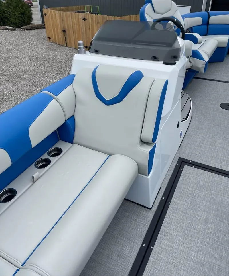 Slide: The Image of 2021 Montara 23' Surfboss boat interior with blue and white seating. - 5