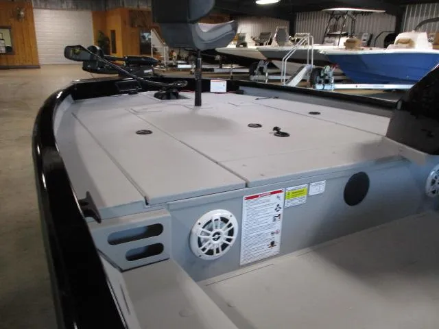 Slide: The Image of 2024 Crestliner CXFC18 boat interior with spacious deck and seating. - 6