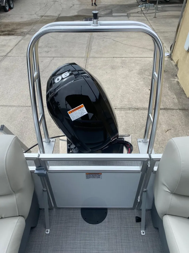 Slide: The Image of 2024 Starcraft LX 20 R boat with a 90 HP outboard motor, viewed from the deck. - 5