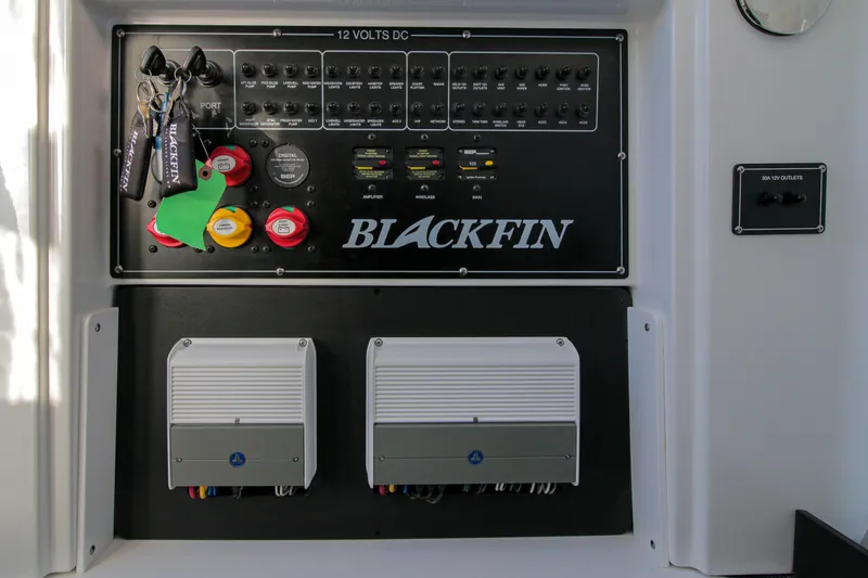Slide: The Image of Control panel of 2023 Blackfin 272 CC boat with switches and keys. - 24