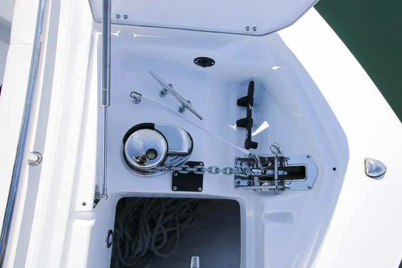 Slide: The Image of Anchor compartment of 2023 Blackfin 302 CC boat with chain and rope storage. - 18