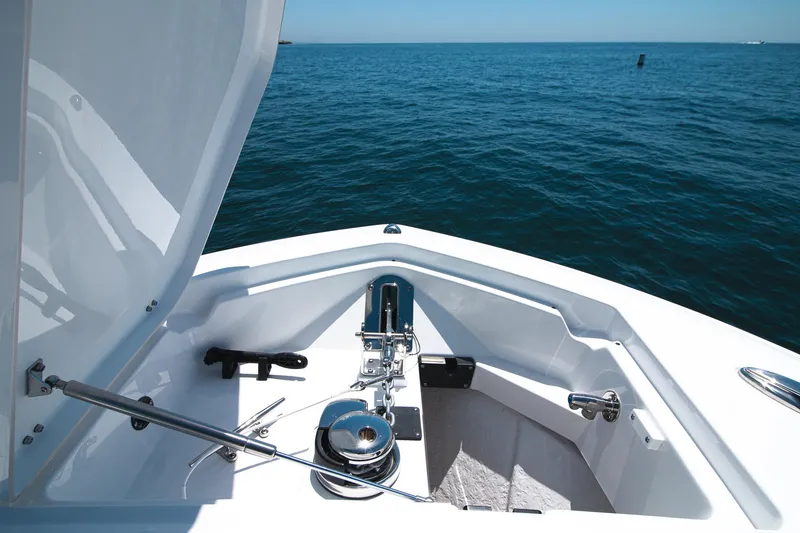 Slide: The Image of 2024 Blackfin 332 CC boat anchor compartment with ocean view. - 11