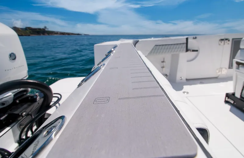 Slide: The Image of 2024 Blackfin 332 CC boat deck with ocean view and clear sky. - 12