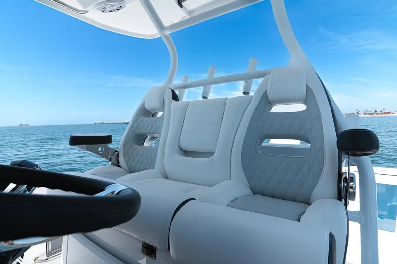 Slide: The Image of 2024 Blackfin 332 CC boat interior with luxurious seating and ocean view. - 8
