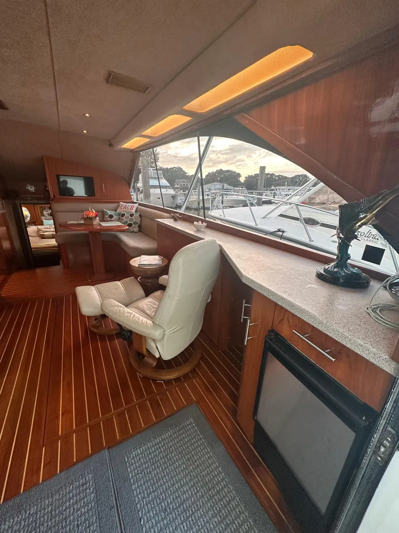 Slide: The Image of Interior of 1993 Ocean Yachts 42 Flybridge with wood flooring and comfortable seating. - 13
