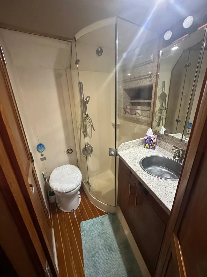 Slide: The Image of Bathroom interior of 1993 Ocean Yachts 42 Flybridge with shower, sink, and toilet. - 18