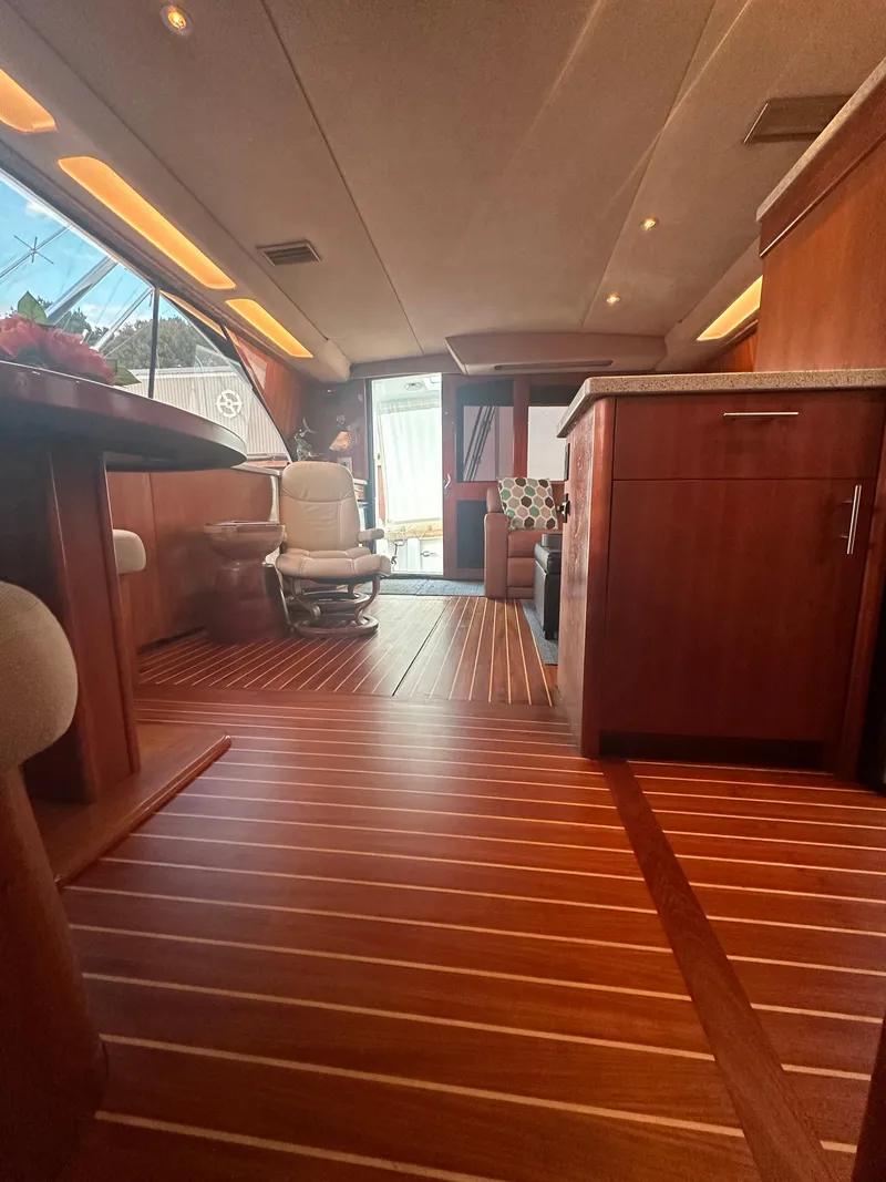 Slide: The Image of Luxurious interior of a 1993 Ocean Yachts 42 Flybridge with elegant wood flooring. - 19