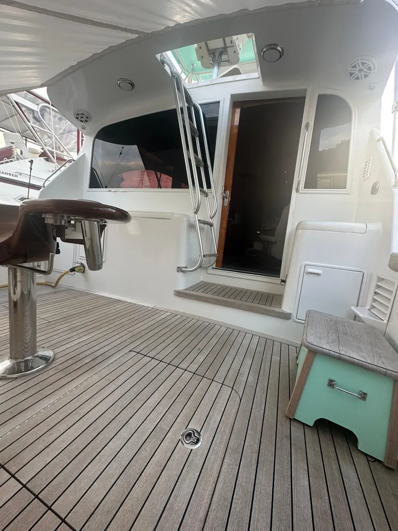 Slide: The Image of 1993 Ocean Yachts 42 Flybridge with teak deck and ladder to upper level. - 7