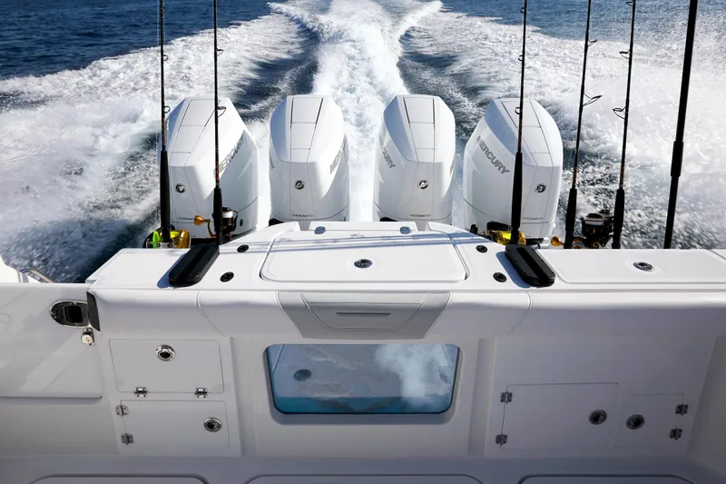 Slide: The Image of 2025 Blackfin 400 CC boat with four powerful engines cruising on open water. - 10
