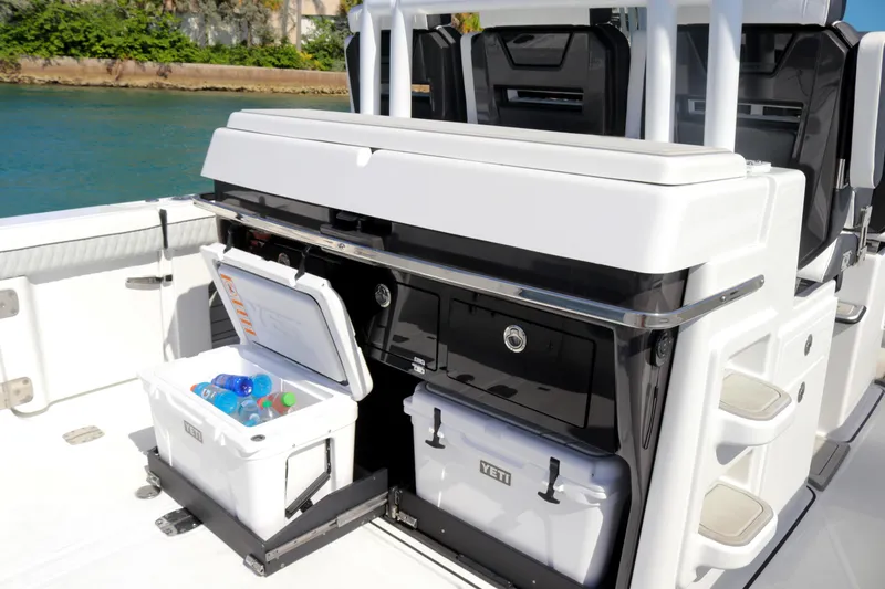 Slide: The Image of 2025 Blackfin 400 CC boat with open Yeti coolers on deck. - 12