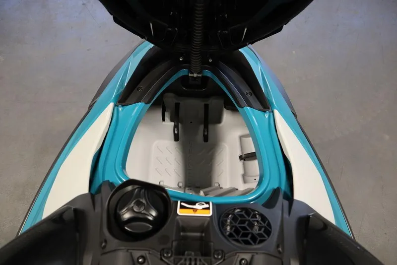 Slide: The Image of 2025 Sea-Doo GTI SE 130 storage compartment, open and empty, showcasing interior design. - 10