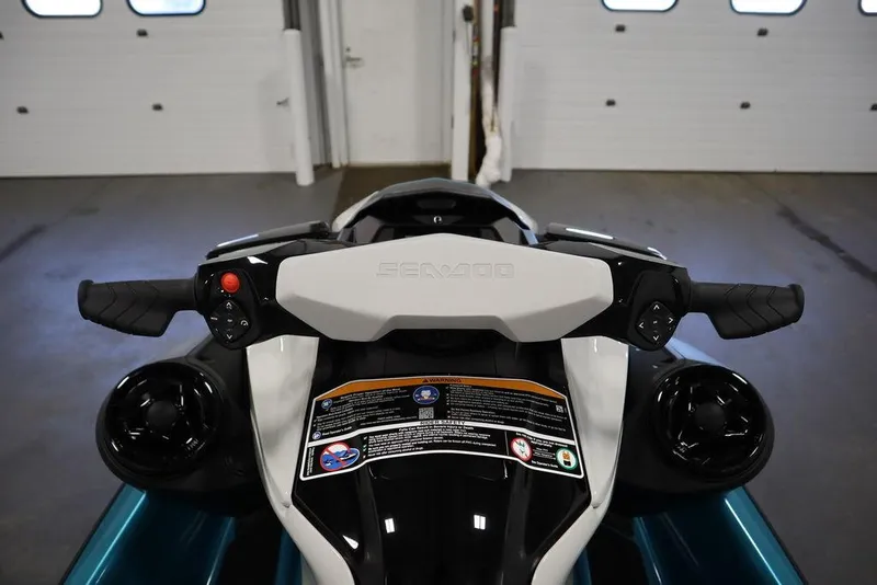 Slide: The Image of Side mirror of 2025 Sea-Doo GTI SE 130 in a garage setting. - 12