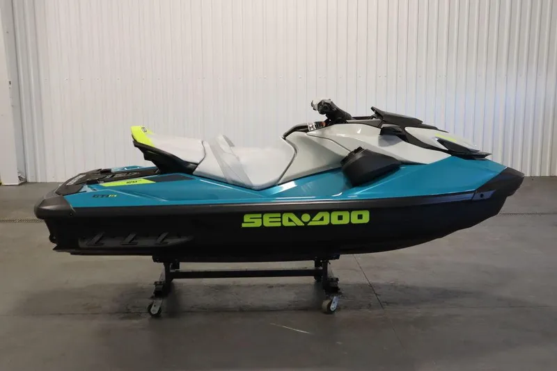 Slide: The Image of 2025 Sea-Doo GTI SE 130 jet ski in a showroom, featuring sleek design and vibrant colors. - 4