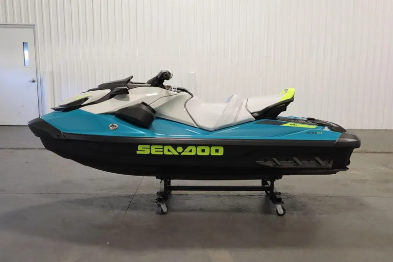 Slide: The Image of 2025 Sea-Doo GTI SE 130 jet ski in a garage, showcasing sleek design and vibrant colors. - 7
