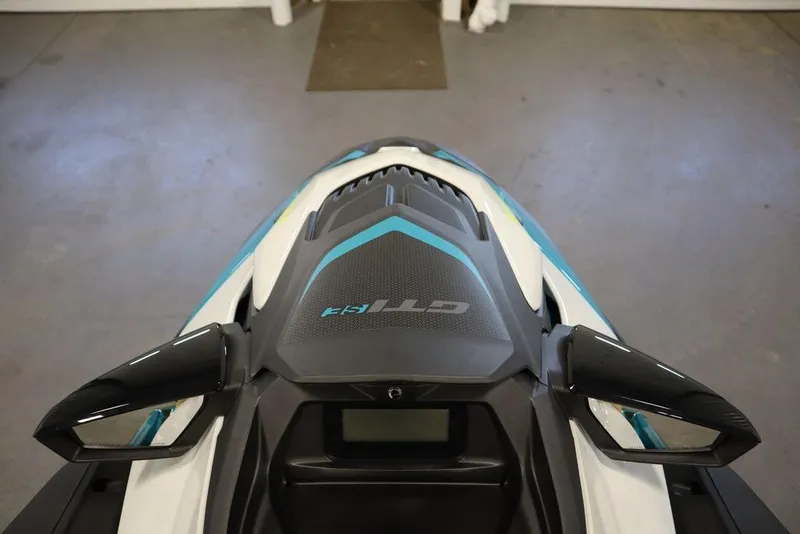 Slide: The Image of 2025 Sea-Doo GTI SE 130 jet ski in a showroom, side view. - 9