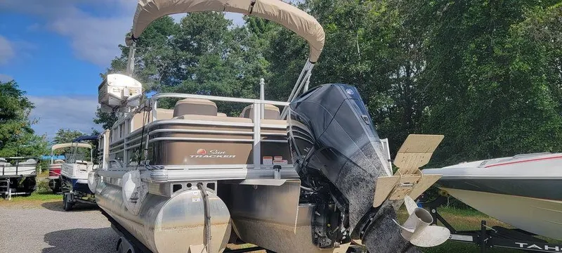 Slide: The Image of 2020 Sun Tracker 22 SPORT FISH XP3 pontoon boat with outboard motor, parked outdoors. - 11