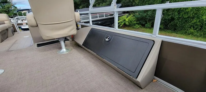 Slide: The Image of 2020 Sun Tracker 22 SPORT FISH XP3 boat interior with seating and storage compartment. - 3