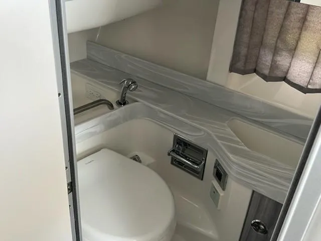 Slide: The Image of 2023 Formula 350 CBR boat bathroom with modern fixtures and sleek design. - 11