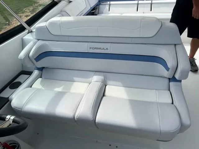 Slide: The Image of 2023 Formula 350 CBR boat interior with white and blue seating. - 12