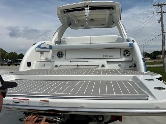 Slide: The Image of 2023 Formula 350 CBR boat, rear view, showcasing spacious deck and modern design. - 13