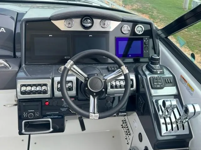 Slide: The Image of 2023 Formula 350 CBR boat dashboard with advanced controls and navigation screens. - 6