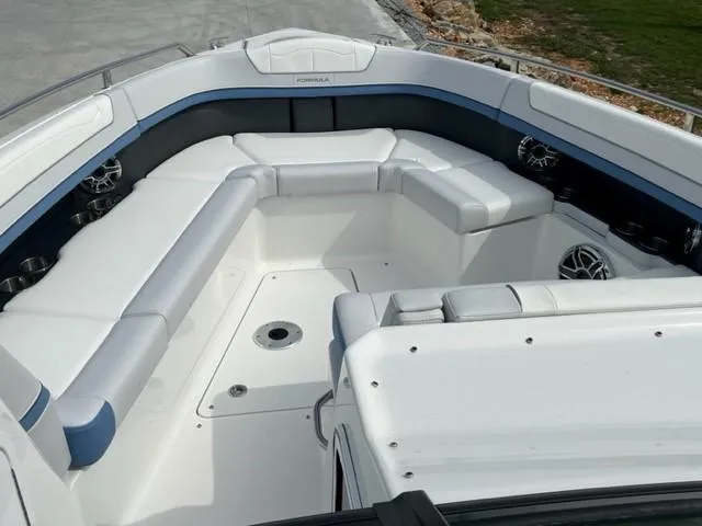Slide: The Image of 2023 Formula 350 CBR boat interior with white seating and modern design. - 8