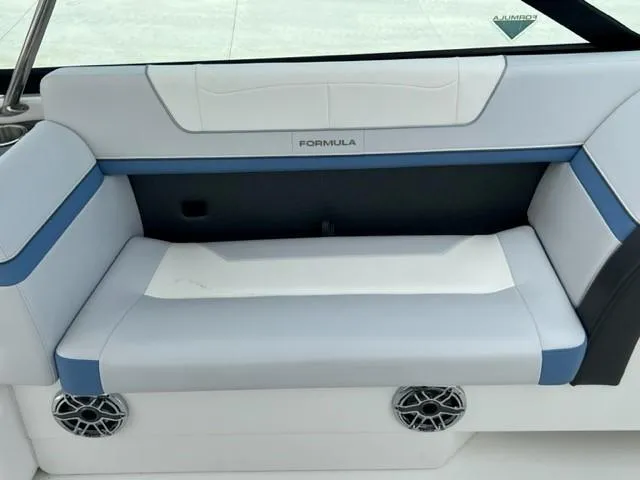 Slide: The Image of 2023 Formula 350 CBR boat interior with white and blue seating. - 9