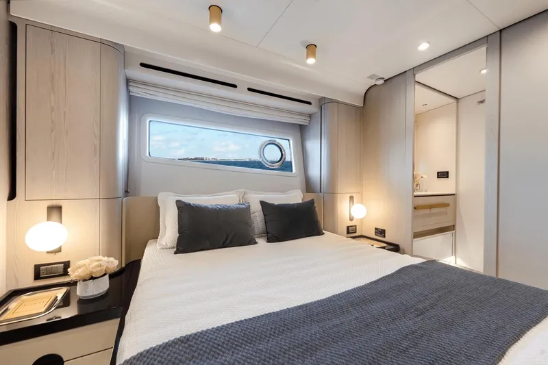 Slide: The Image of Luxurious bedroom interior of 2024 Azimut Fly 78 yacht with modern design and ocean view. - 13