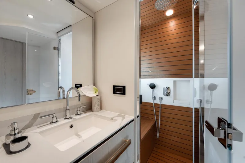 Slide: The Image of Luxurious bathroom in 2024 Azimut Fly 78 yacht with modern fixtures and wooden shower. - 19