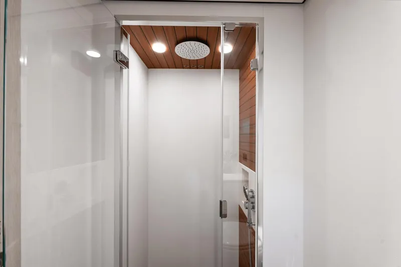 Slide: The Image of 2024 Azimut Fly 78 yacht shower with modern design and wooden ceiling accents. - 22