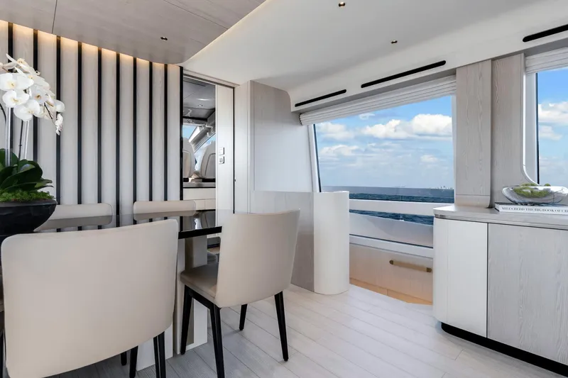 Slide: The Image of Luxurious interior of 2024 Azimut Fly 78 yacht with modern dining area and ocean view. - 38