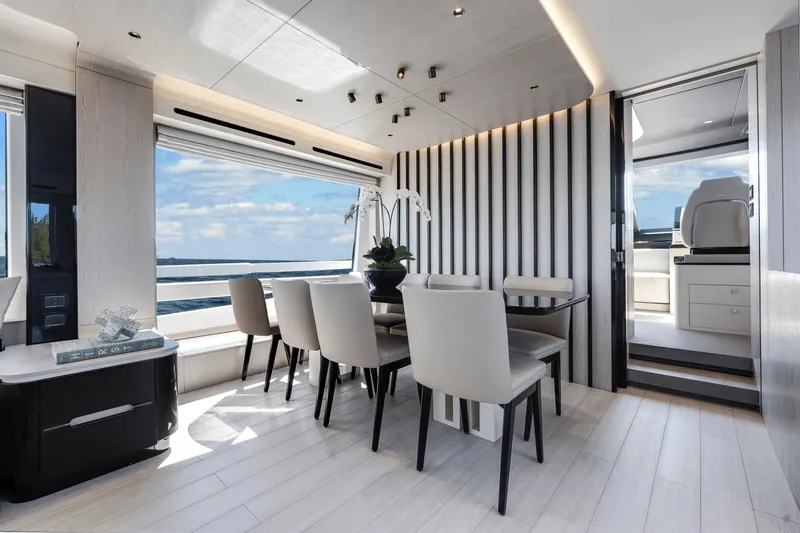 Slide: The Image of Luxurious interior of 2024 Azimut Fly 78 yacht with modern dining area and panoramic ocean view. - 40