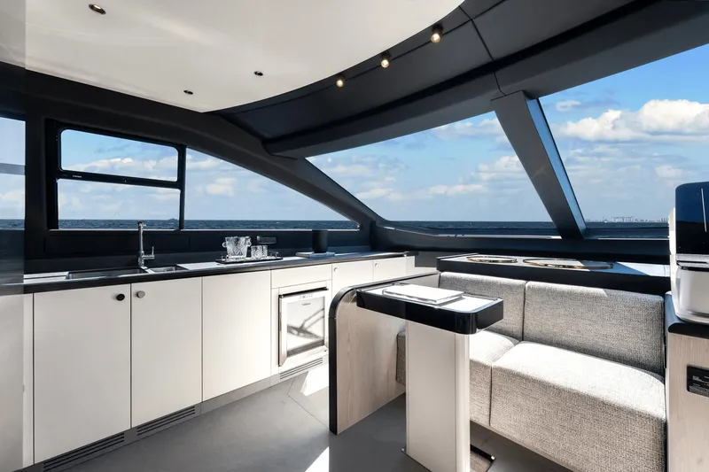 Slide: The Image of Modern kitchen and seating area inside 2024 Azimut Fly 78 yacht with ocean view. - 42