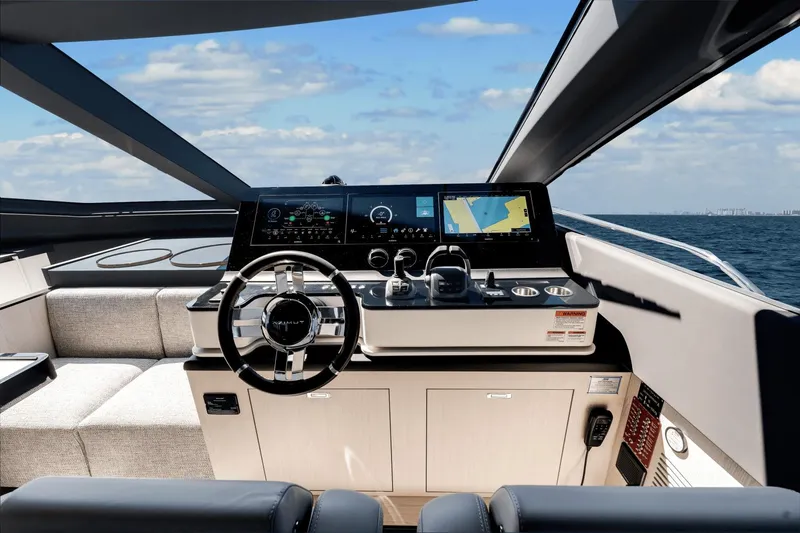 Slide: The Image of 2024 Azimut Fly 78 yacht helm with modern navigation system and ocean view. - 45