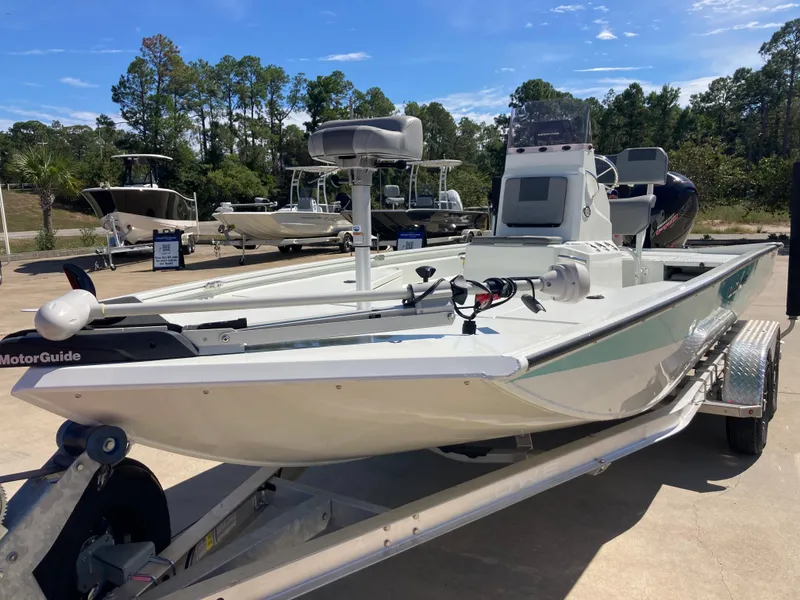 The Image of 2022 Lowe BAY 20 boat on trailer, equipped with MotorGuide trolling motor. - 0