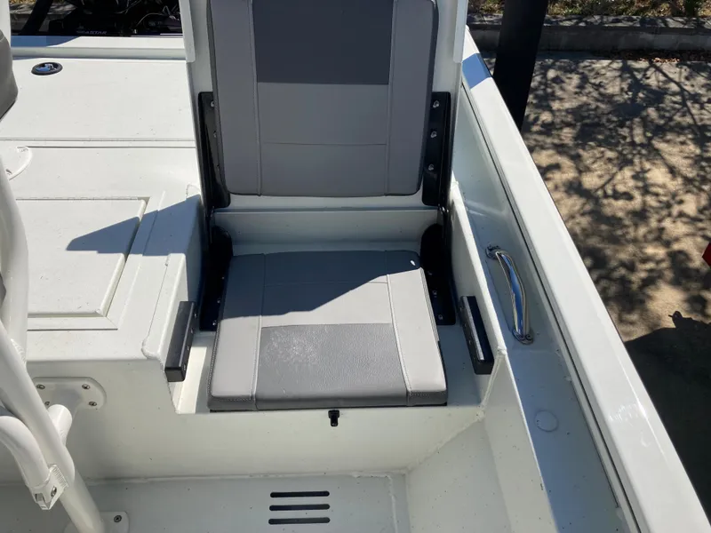 Slide: The Image of 2022 Lowe BAY 20 boat with gray seating and storage compartment. - 11
