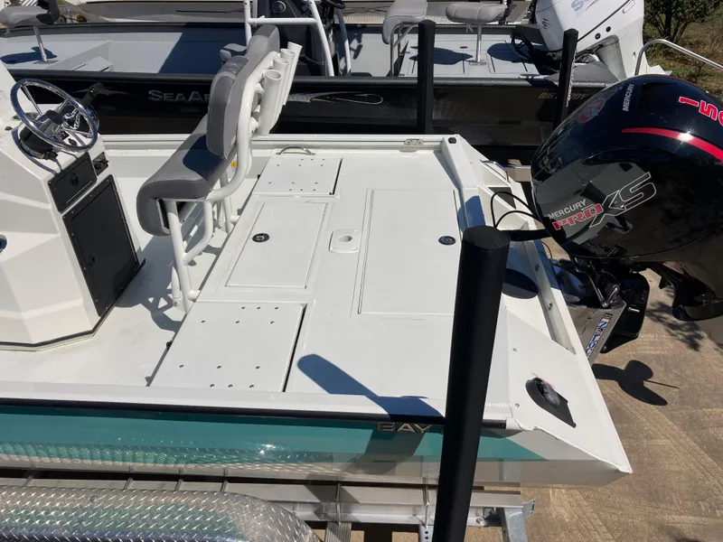 Slide: The Image of 2022 Lowe BAY 20 boat with Mercury outboard motor, docked. - 3