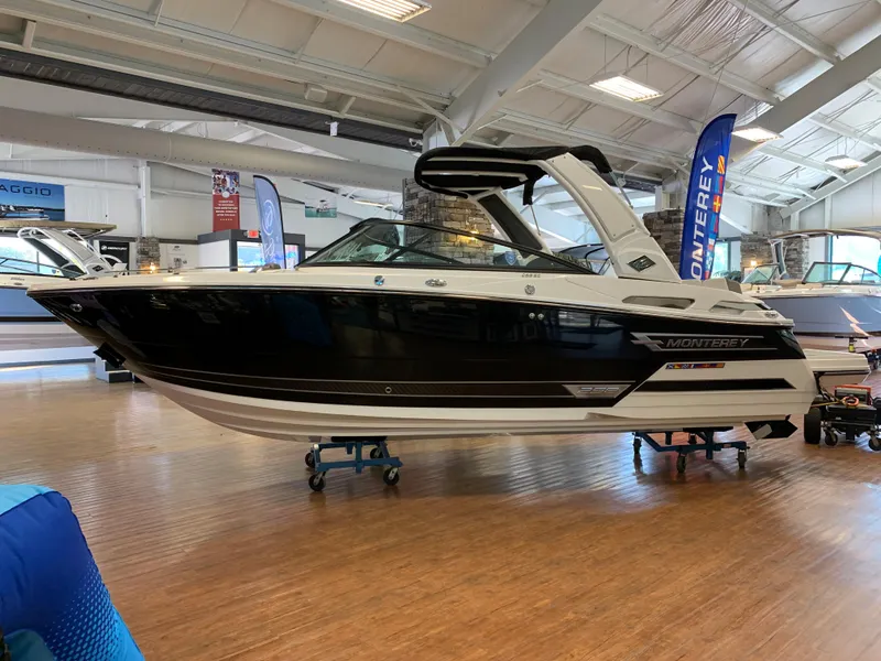 The Image of 2024 Monterey 258 Super Sport boat displayed in an indoor showroom. - 0