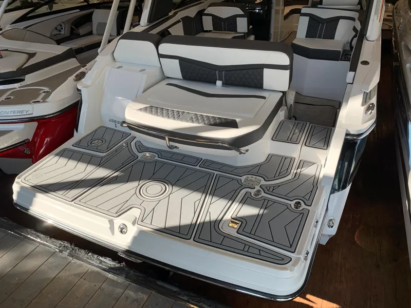 Slide: The Image of 2024 Monterey 258 Super Sport boat with spacious seating and modern design. - 1